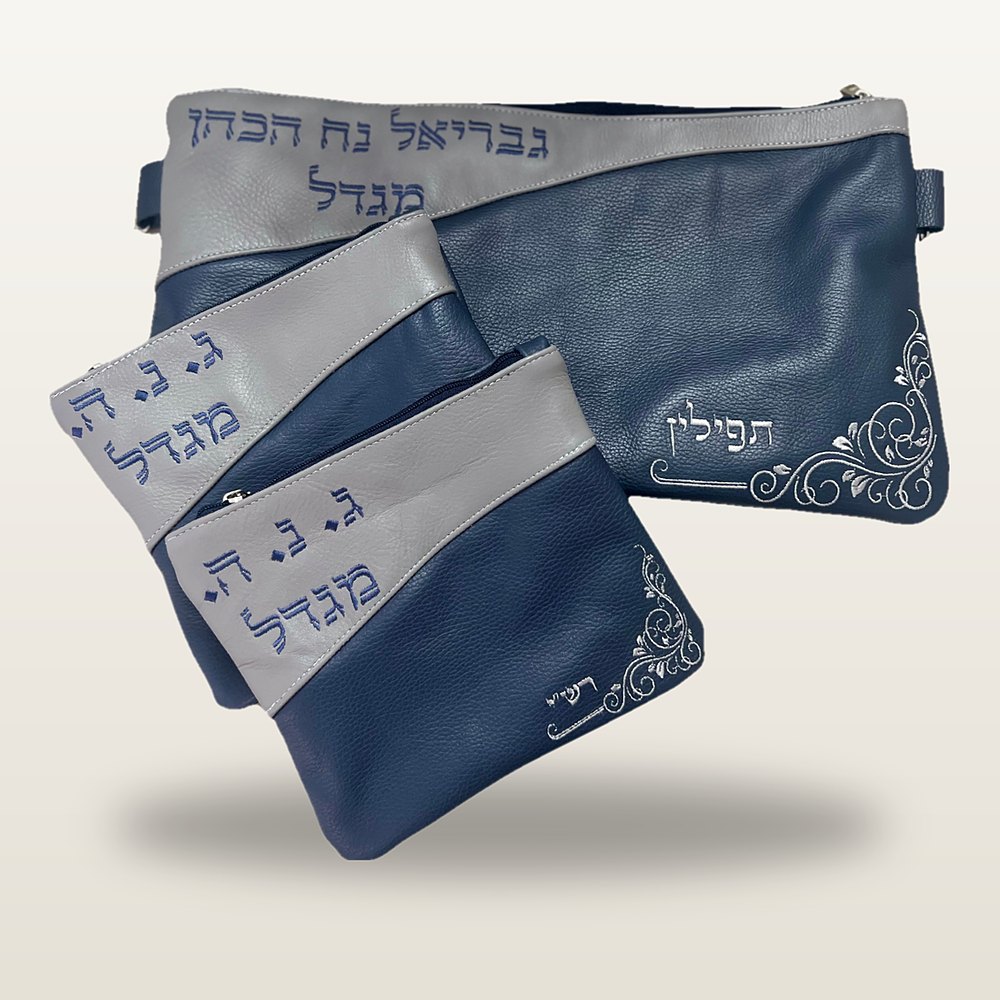 תיק טלית ושני נרתיקי תפילין מעור בכחול ואפור, רקמת שם בכחול ועיטורי פרחים בכסף בפינות