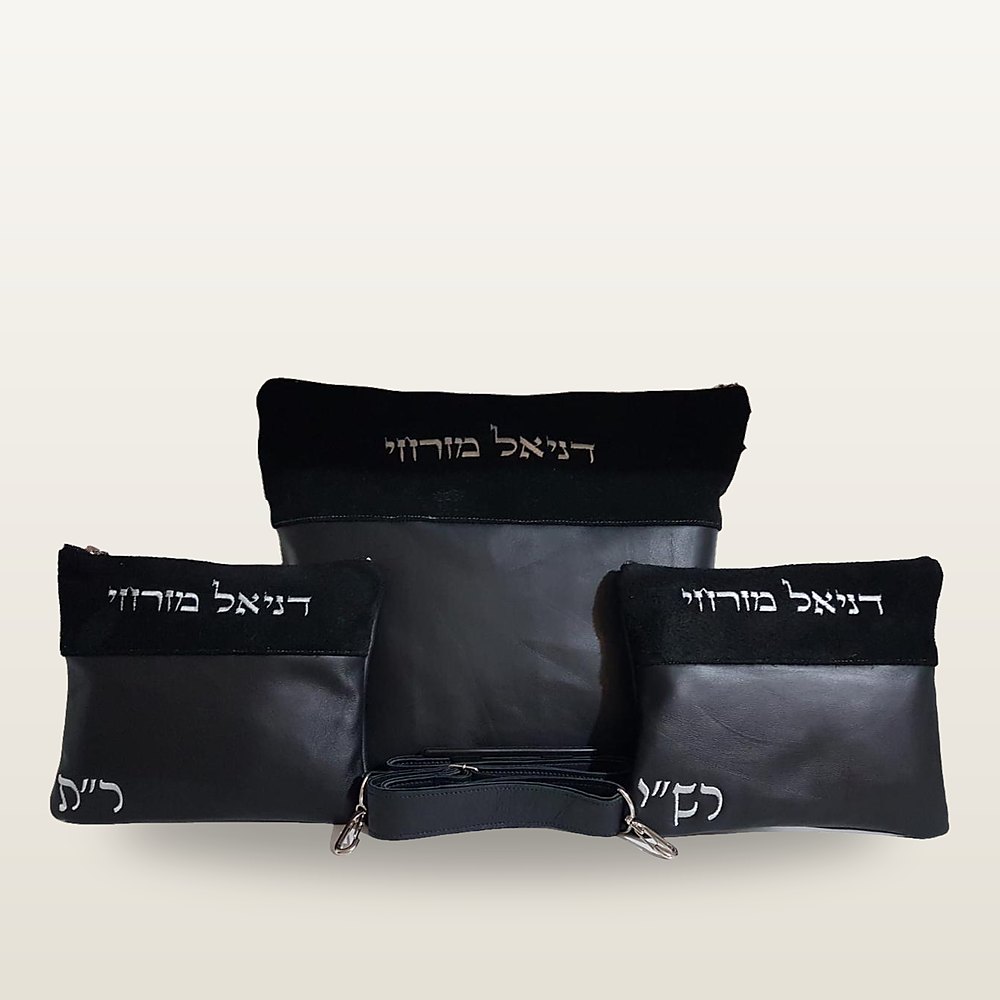סט טלית ותפילין מעור שחור: תיק טלית, שני נרתיקי תפילין ורצועה, רקמת שם אישית בהירה על פס עליון שחור