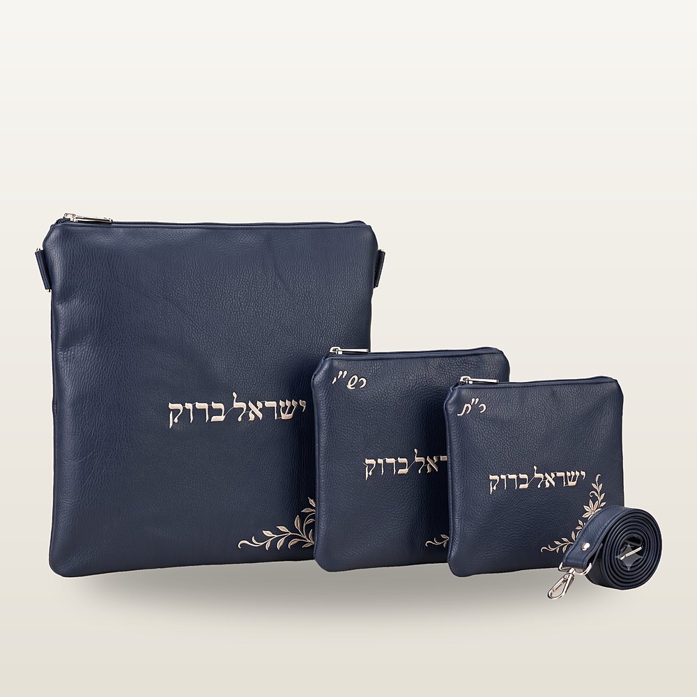 סט טלית ותפילין בכחול עמוק מעור ארגנטינאי משובח: תיק טלית, שני נרתיקי תפילין ורצועה, רקמה בהירה עם ענפי עלים
