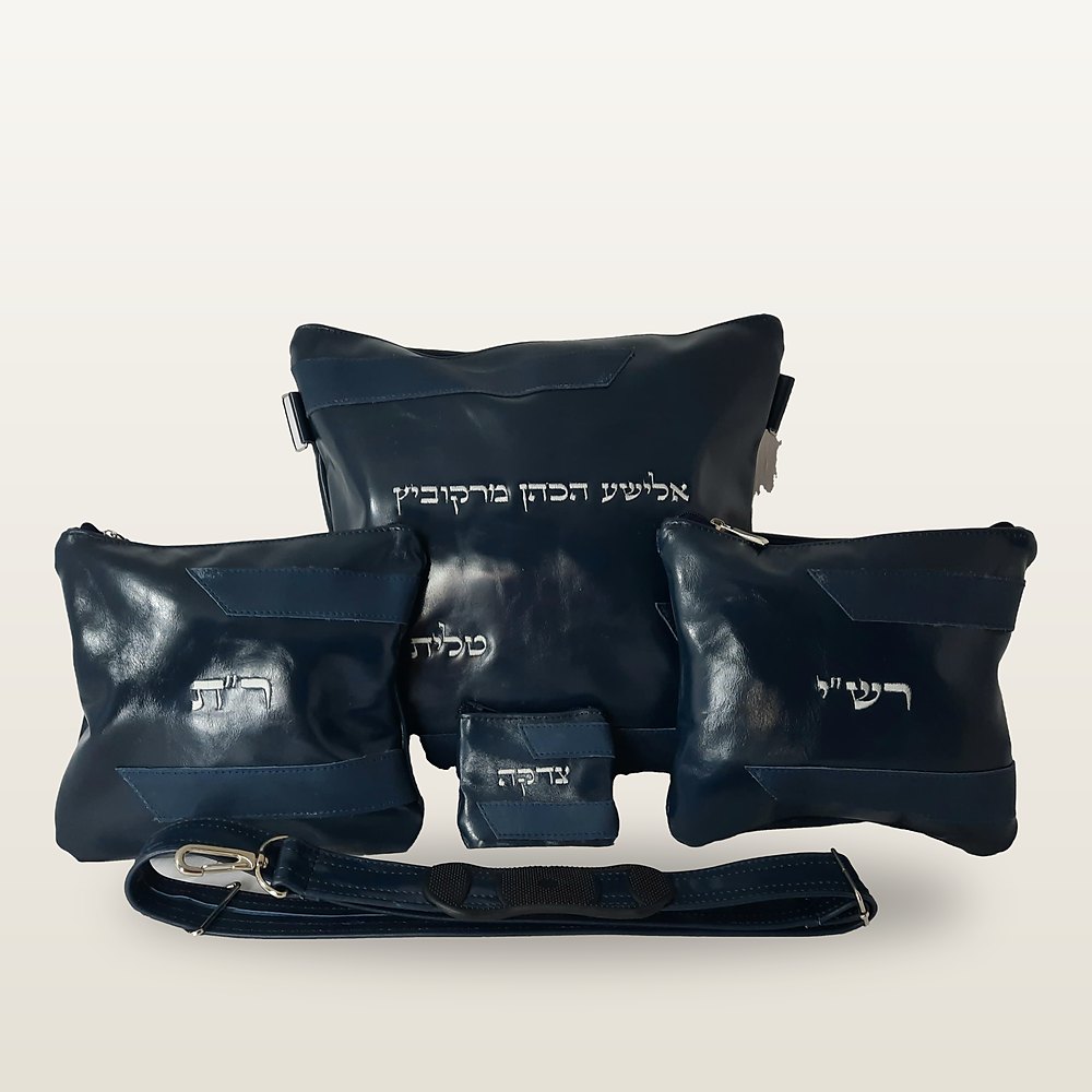 סט עור כחול כהה מבריק: תיק טלית, שני נרתיקי תפילין, כיס קטן ורצועה, עם רקמה בחוטי כסף